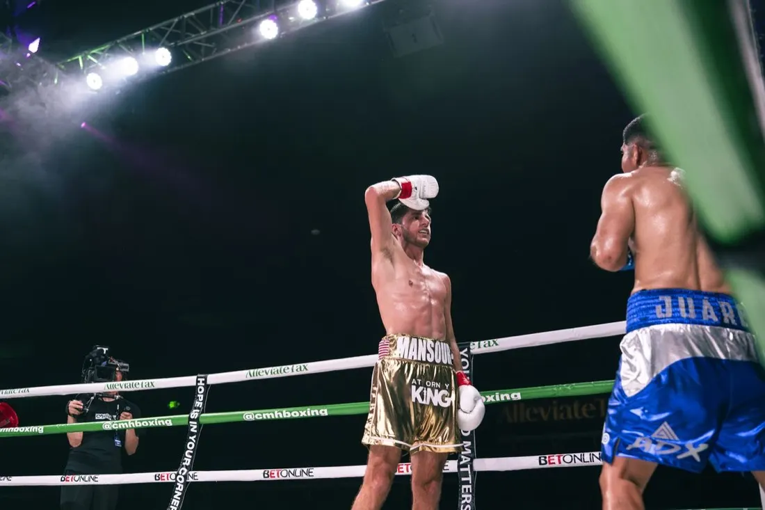 Jonny Mansour gets his hand raised in victory