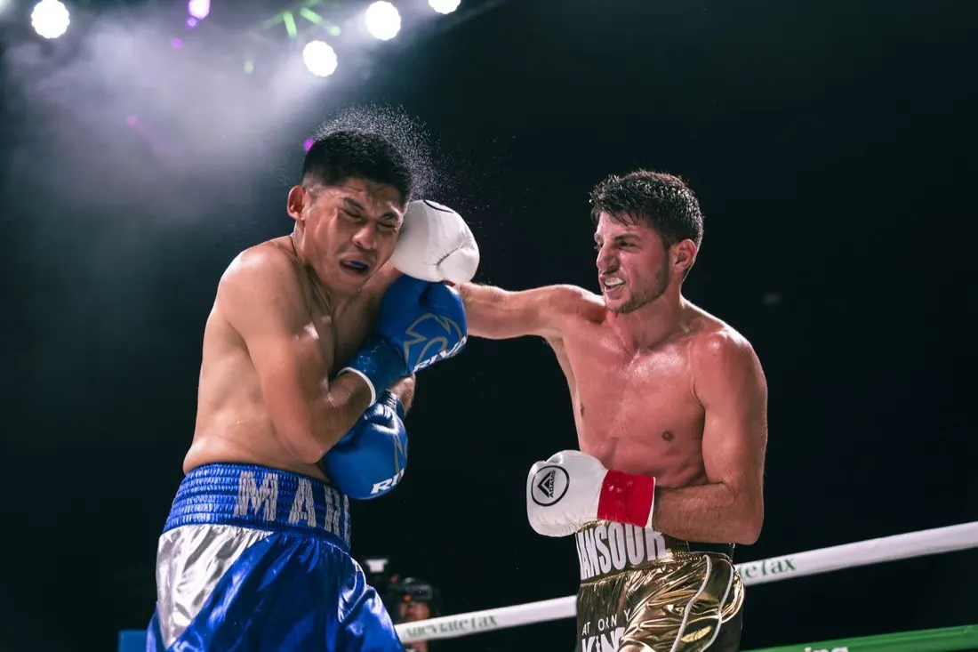 Two fighters face off in the ring